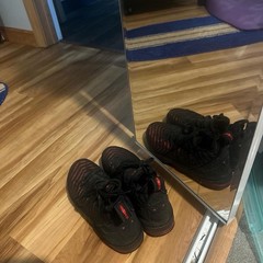 These are Nike LeBron 16 . Black and red color way. Size 4Y .