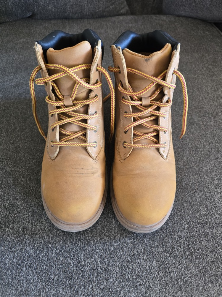 Timberland boots feature a classic wheat-colored nubuck upper and a black padded