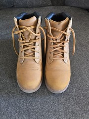 Timberland boots feature a classic wheat-colored nubuck upper and a black padded