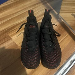 These are Nike LeBron 16 . Black and red color way. Size 4Y .