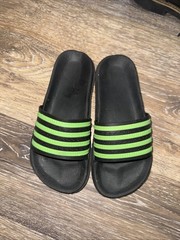 Lightly used adidas Adilette Aqua Slides in Black/Green. Comfy & quick-dry!