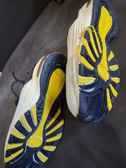 vintage or retro-style athletic sneakers featuring a chunky design,…