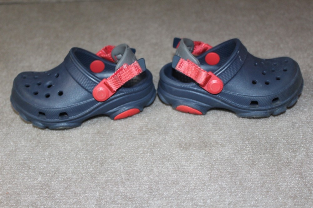 Crocs Crocband clogs in navy blue with a red and white midsole stripe Size J 6