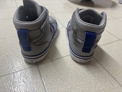 The image shows a pair of Converse Pro Blaze Strap Leather High Top sneakers