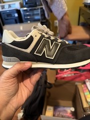 New Balance 574 Core sneakers in black and white. Kids 4