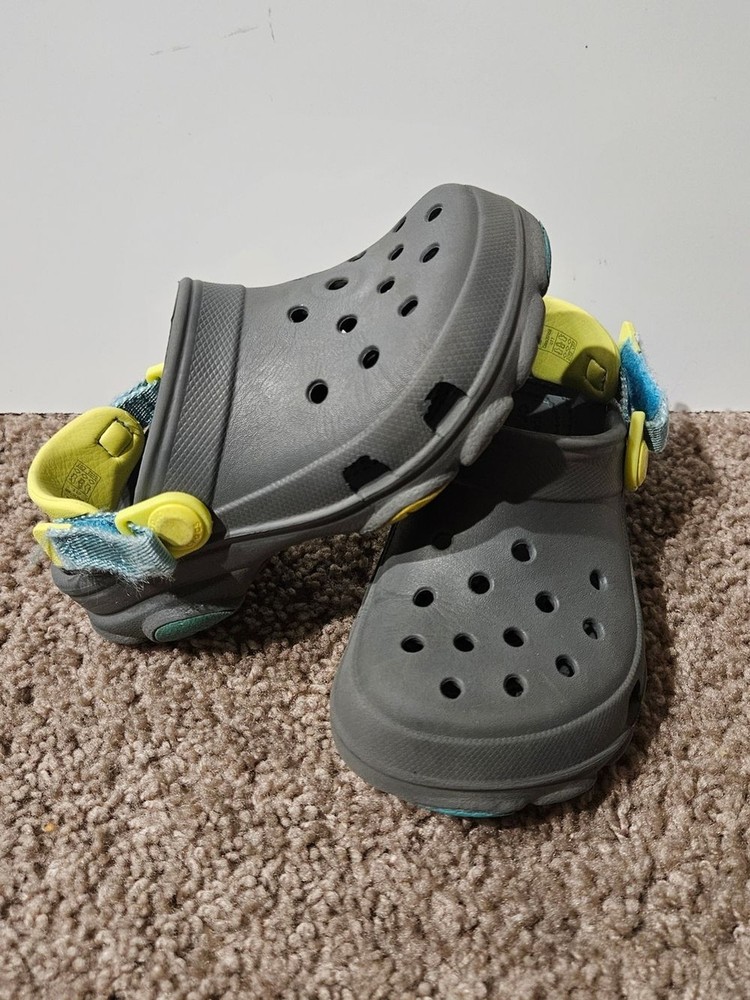 CROCS Kids Gray Clogs with Yellow and Blue Accents