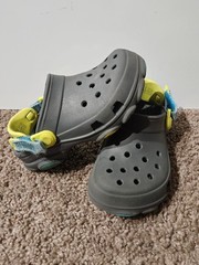 CROCS Kids Gray Clogs with Yellow and Blue Accents