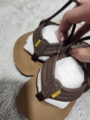 Reef toddler boy’s brown sandals with a slingback strap and comfort footbed