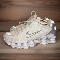 Nike Shox TL sneakers in a white and metallic silver colorway, Youth 6Y