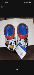Crocs Kids‘ Toy Story Woody Classic Clogs in Blue Jean, featuring a Woody-theme