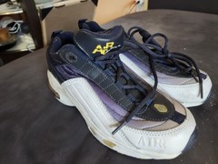 vintage or retro-style athletic sneakers featuring a chunky design,…