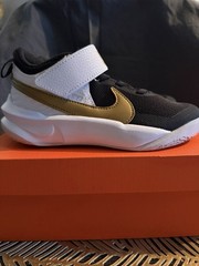 NWB Nike Kid’s Team Hustle Sneakers Tennis Shoes Gold Black White Size 12C US