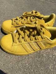 Adidas Superstar yellow sneakers