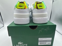 Lacoste T-Clip junior trainers feature a white synthetic upper with iridescent g