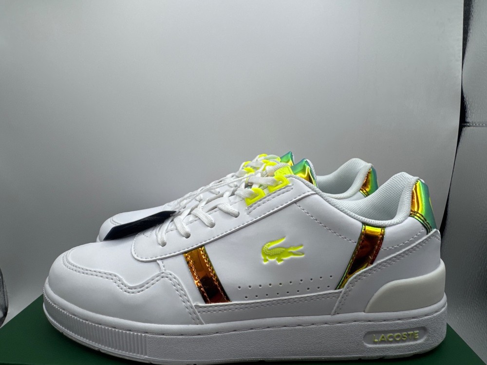 Lacoste T-Clip junior trainers feature a white synthetic upper with iridescent g