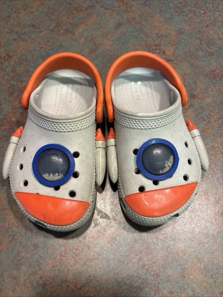 Crocs Kids Classic Rocket Ship Space Clog Gray/Orange Moving Stars Glow Size c8