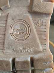 Timberland boots feature a classic wheat-colored nubuck upper and a black padded