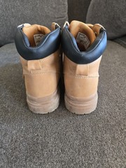 Timberland boots feature a classic wheat-colored nubuck upper and a black padded